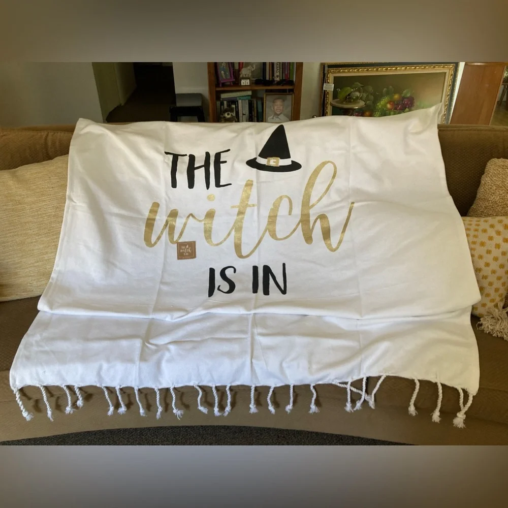 “The Witch Is In” by mudpie White Throw Blanket